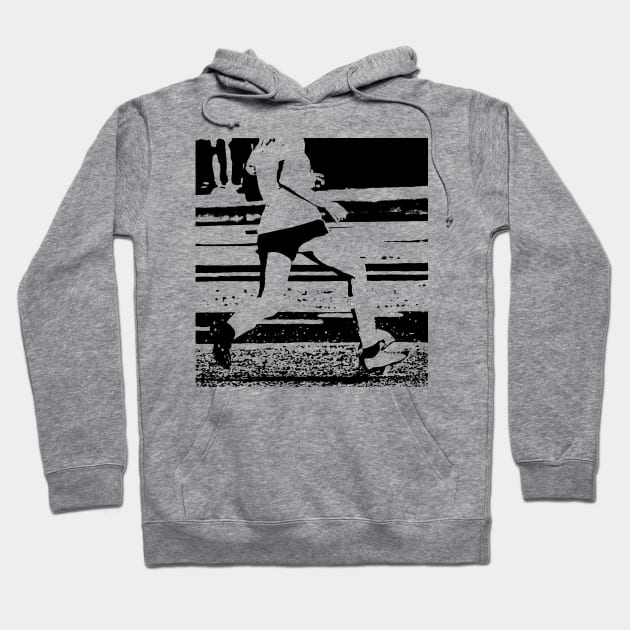 Girl running with soccer ball on a field Hoodie by Woodys Designs